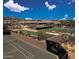 Expansive aerial view of the community with tennis courts, and lush landscaping at 10651 E Fernwood Ln, Scottsdale, AZ 85262