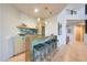Stylish bar area featuring marble countertops, modern stools, and custom lighting, perfect for entertaining at 10651 E Fernwood Ln, Scottsdale, AZ 85262
