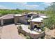 Stunning desert home showcasing custom stone, modern architecture and a serene outdoor patio with mountain views at 10651 E Fernwood Ln, Scottsdale, AZ 85262