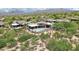 Expansive desert home featuring a sparkling pool and mountain views at 10651 E Fernwood Ln, Scottsdale, AZ 85262