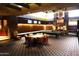 Game room features a pool table, seating, and entertainment options in a stylish, inviting space at 10651 E Fernwood Ln, Scottsdale, AZ 85262