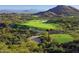 Expansive golf course with rolling green hills, sand traps, and stunning mountain views at 10651 E Fernwood Ln, Scottsdale, AZ 85262