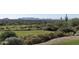 Picturesque golf course with desert landscaping and distant mountain views at 10651 E Fernwood Ln, Scottsdale, AZ 85262