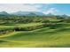 Expansive golf course with lush green fairways and mountain views at 10651 E Fernwood Ln, Scottsdale, AZ 85262