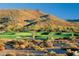 Scenic golf course nestled in a desert landscape with native vegetation at 10651 E Fernwood Ln, Scottsdale, AZ 85262