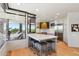 Modern kitchen with large center island and breakfast bar seating, stainless steel appliances, and recessed lighting at 10651 E Fernwood Ln, Scottsdale, AZ 85262