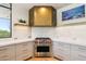 Modern kitchen boasts stainless steel appliances, sleek countertops, and custom cabinetry at 10651 E Fernwood Ln, Scottsdale, AZ 85262