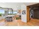 Contemporary kitchen with stainless steel appliances, white countertops, an island with bar stool seating, and wood floors at 10651 E Fernwood Ln, Scottsdale, AZ 85262
