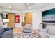 Spacious living room with modern furnishings, artwork, and sliding barn door at 10651 E Fernwood Ln, Scottsdale, AZ 85262
