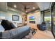 Spacious main bedroom featuring fireplace, TV, king bed, and outdoor patio access at 10651 E Fernwood Ln, Scottsdale, AZ 85262