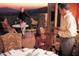 Outdoor dining area with guests enjoying the sunset views at 10651 E Fernwood Ln, Scottsdale, AZ 85262