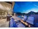 Outdoor patio featuring a pool, fire pit, and outdoor seating at 10651 E Fernwood Ln, Scottsdale, AZ 85262