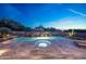 Inviting pool and spa area with desert landscaping create a relaxing outdoor oasis at 10651 E Fernwood Ln, Scottsdale, AZ 85262