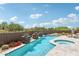 Tranquil backyard pool and hot tub area with desert landscaping at 10651 E Fernwood Ln, Scottsdale, AZ 85262