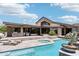Stunning outdoor pool and hot tub area with beautiful landscaping and a covered patio at 10651 E Fernwood Ln, Scottsdale, AZ 85262