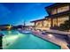 Desert home's stunning outdoor area with a pool, spa, and elegant patio at 10651 E Fernwood Ln, Scottsdale, AZ 85262