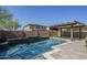 Backyard oasis featuring a refreshing pool, a covered patio, and landscaped areas, perfect for outdoor enjoyment at 10925 E Toluca Ave, Mesa, AZ 85212