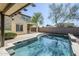 Gorgeous pool area featuring a covered patio, lush greenery, and ample space for outdoor activities and entertaining at 10925 E Toluca Ave, Mesa, AZ 85212