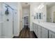 Bright bathroom features a glass shower and double vanity with modern fixtures at 10925 E Toluca Ave, Mesa, AZ 85212