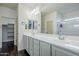 Bright bathroom featuring a glass shower and double vanity with modern fixtures at 10925 E Toluca Ave, Mesa, AZ 85212