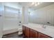 Bathroom with a single sink vanity and a shower-tub combo with tiled walls at 10925 E Toluca Ave, Mesa, AZ 85212