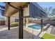 Spacious covered patio overlooking the pool offers a shaded retreat with ample room for dining and lounging at 10925 E Toluca Ave, Mesa, AZ 85212