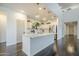 Modern kitchen with an island, stainless steel appliances, and stylish pendant lighting at 10925 E Toluca Ave, Mesa, AZ 85212