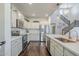 Modern kitchen featuring stainless steel appliances, white cabinets, and a kitchen island at 10925 E Toluca Ave, Mesa, AZ 85212