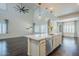 Open kitchen with island, pendant lights, and stainless steel dishwasher at 10925 E Toluca Ave, Mesa, AZ 85212