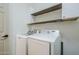 Well-lit laundry room with modern appliances, granite counters, and storage cabinets at 10925 E Toluca Ave, Mesa, AZ 85212