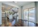 Spacious living room featuring an open layout and sliding glass doors leading to the patio at 10925 E Toluca Ave, Mesa, AZ 85212