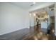 Open-concept living room with dark wood floors leading into the modern kitchen at 10925 E Toluca Ave, Mesa, AZ 85212