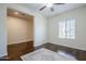Bright living room with a ceiling fan, hardwood floors, and a window for natural light at 10925 E Toluca Ave, Mesa, AZ 85212