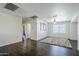 Expansive living space with modern flooring, ample lighting, and a view into a hallway at 10925 E Toluca Ave, Mesa, AZ 85212