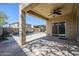 An outdoor covered patio with a ceiling fan overlooking the pool at 10925 E Toluca Ave, Mesa, AZ 85212