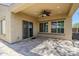 An outdoor covered patio with a ceiling fan, tile flooring, and plenty of space at 10925 E Toluca Ave, Mesa, AZ 85212