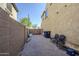 Spacious side yard with a paved walkway, privacy wall, and gate access offers practicality and functionality at 10925 E Toluca Ave, Mesa, AZ 85212