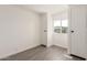 This bedroom has neutral walls, gray wood-look floors, and a closet and window at 11000 N 91St Ave # 20, Peoria, AZ 85345