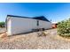 Exterior view of the home, showing gravel landscaping, AC unit, and satelite dish at 11000 N 91St Ave # 20, Peoria, AZ 85345