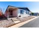 Front exterior view of the home showing the entrance and desert landscaping at 11000 N 91St Ave # 20, Peoria, AZ 85345