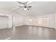 Large living area featuring neutral colors, luxury vinyl plank flooring, and ceiling fan at 11000 N 91St Ave # 20, Peoria, AZ 85345