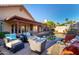 An inviting backyard with a fire pit, comfortable seating and a pool perfect for outdoor entertaining at 11085 E Mary Katherine Dr, Scottsdale, AZ 85259