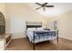 Comfortable bedroom with a ceiling fan and shutters for adjustable natural lighting at 11085 E Mary Katherine Dr, Scottsdale, AZ 85259