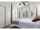 Bright bedroom with a vaulted ceiling, shuttered windows, and built in closet at 11085 E Mary Katherine Dr, Scottsdale, AZ 85259