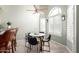 Charming dining area with a round table, four chairs, and a large window for natural light at 11085 E Mary Katherine Dr, Scottsdale, AZ 85259