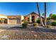 Inviting single-Gathering home features a well-manicured yard and charming desert landscaping at 11085 E Mary Katherine Dr, Scottsdale, AZ 85259