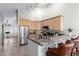 Spacious kitchen featuring stainless steel appliances and a breakfast bar with seating at 11085 E Mary Katherine Dr, Scottsdale, AZ 85259