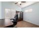 Comfortable and bright office with shutters, wood floors and a wooden cabinet at 11085 E Mary Katherine Dr, Scottsdale, AZ 85259