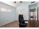 Bright office space featuring a ceiling fan, shuttered window and a sliding closet at 11085 E Mary Katherine Dr, Scottsdale, AZ 85259