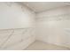 Spacious walk-in closet with metal shelving, perfect for organization and storage at 11085 E Mary Katherine Dr, Scottsdale, AZ 85259
